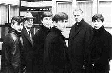 Dick James (second left) with The Beatles and George Martin